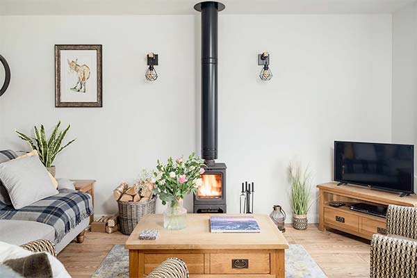 Wood burning stove in cosy Aviemore lodge